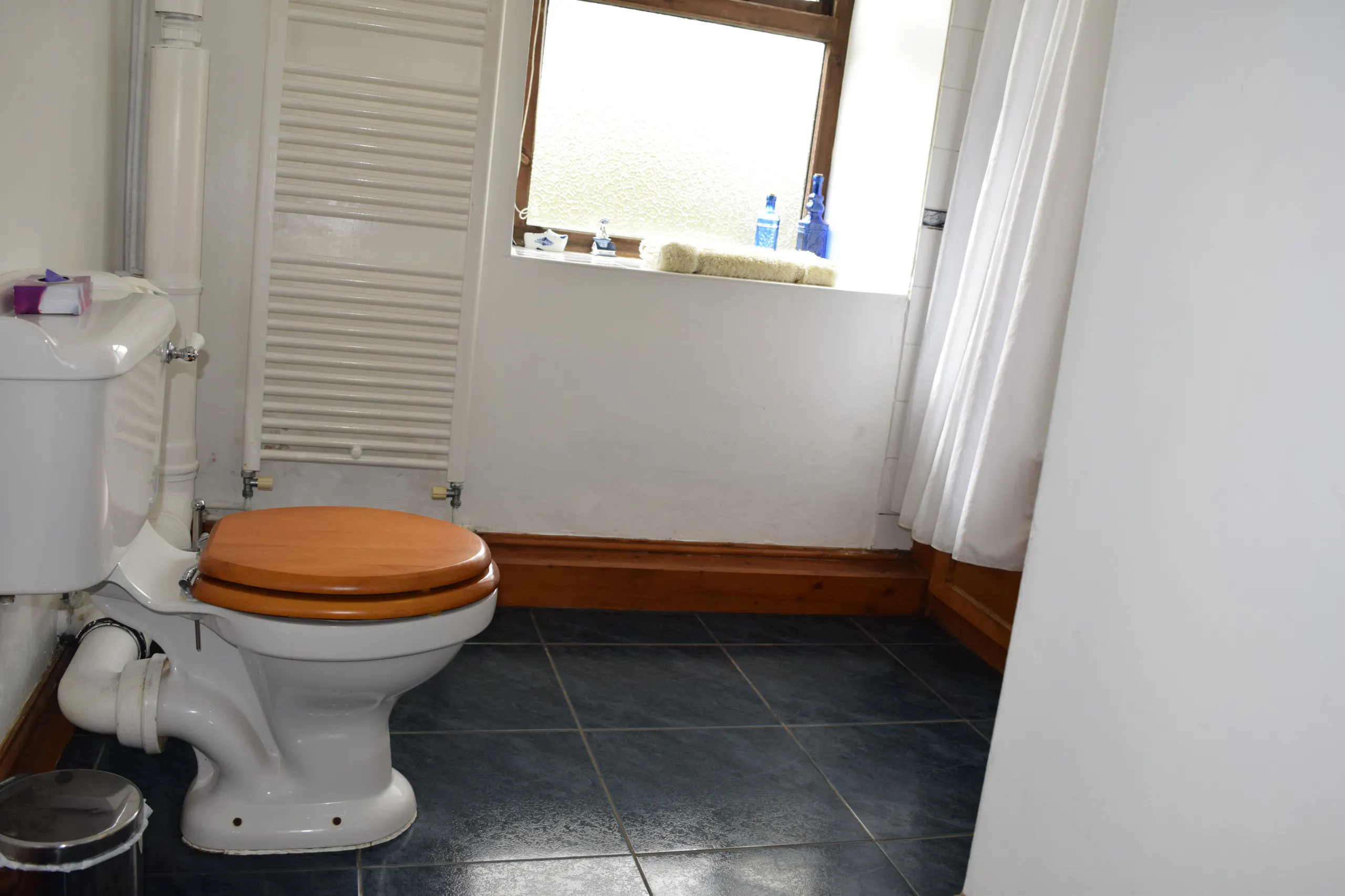Ground Floor en-suite bathroom: WC and heated towel rail
