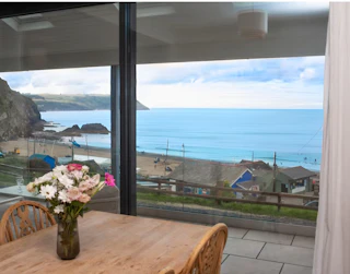 Views from the dining table over the patio and the beach