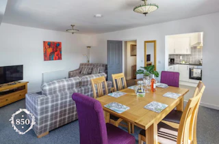 Dining table and six chairs, two 2-seater sofas, floor lamp, TV, DVD
