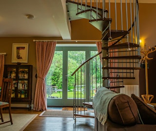Spiral staircase and French doors leading to the garden