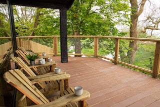 Veranda with wooden seating and views over the lake