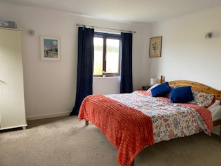 Double bedroom with wardrobe, bed, window