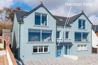 Exterior of Harmon Vale with paved parking area in front and level access